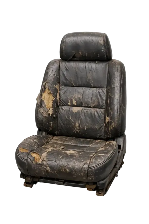 Worn out leather car seat close 2